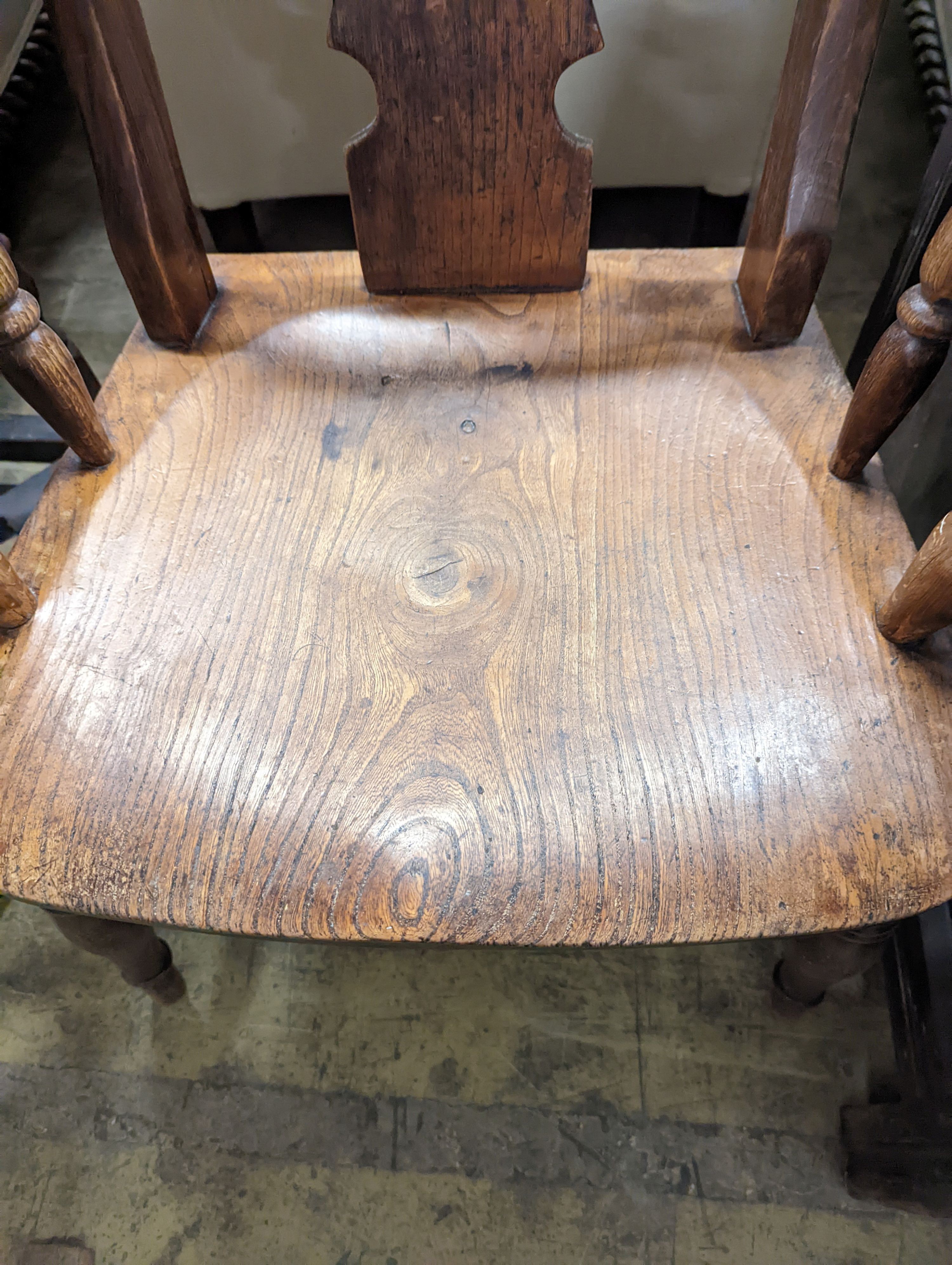 A Victorian elm and beech Windsor armchair with pierced splat stamped J D 33, width 56cm, depth 43cm, height 112cm